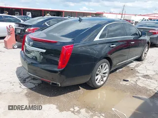 2013 Cadillac XTS Premium with VIN 2G61S5S39D9144177, listed as a IAAI auction lot 42111910 with 69,830 mi miles. Bid and sale history available at carsss.com. Image 4.