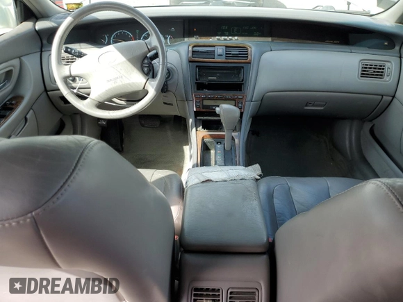 2000 Toyota Avalon XL with VIN 4T1BF28B3YU002835, listed as a Copart auction lot 50902115 with 128,699 mi miles and Salvage Title. Bid and sale history available at DreamBid. Image 8.