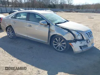 2013 Cadillac XTS Premium with VIN 2G61S5S39D9137262, listed as a IAAI auction lot 41748909 with 121,311 mi miles. Bid and sale history available at carsss.com. Image 1.