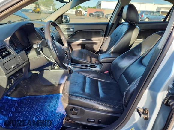 2010 Ford Fusion Hybrid with VIN 3FADP0L33AR131403, listed as a Copart auction lot 65476625 with 188,498 mi miles and Salvage title. Bid and sale history available at DreamBid. Image 7.