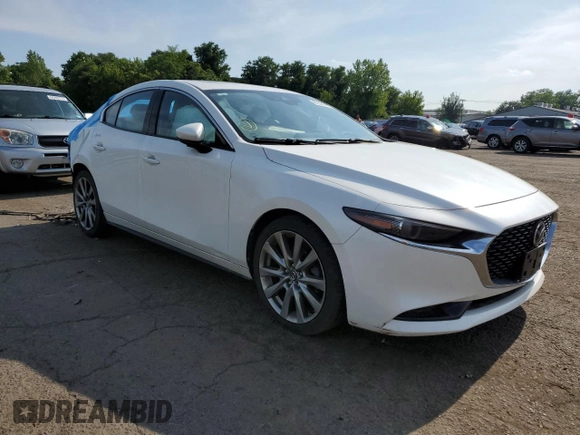 2020 Mazda 3 Premium with VIN JM1BPAEM8L1169106, listed as a Copart auction lot 63565875 with 61,209 mi miles and Salvage title. Bid and sale history available at DreamBid. Image 4.