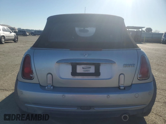 2005 MINI Convertible with VIN WMWRF33465TG10044, listed as a Copart auction lot 50364235 with 152,186 mi miles and Salvage title. Bid and sale history available at DreamBid. Image 6.