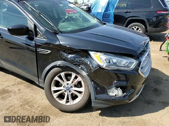 2017 Ford Escape SE z VIN 1FMCU0GD5HUD52467, wystawiony jako Copart lot #70616944 z przebiegiem 115 876 mil mil oraz Szkoda całkowita • Salvage title. Historia ofert i sprzedaży dostępna na DreamBid. Obrazek 11.