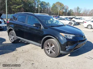 2018 Toyota RAV4 XLE with VIN 2T3RFREV9JW793956, listed as a IAAI auction lot 41012152 with 77,033 mi miles. Bid and sale history available at carsss.com. Image 1.