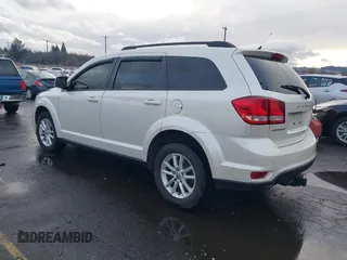 2014 Dodge Journey SXT with VIN 3C4PDCBGXET182430, listed as a IAAI auction lot 41599489 with 143,889 mi miles. Bid and sale history available at carsss.com. Image 3.