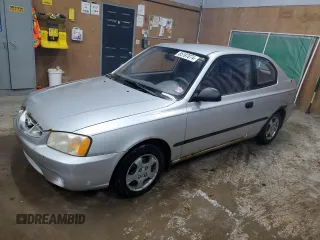 2002 Hyundai Accent z VIN KMHCF35G82U192732, wystawiony jako Copart lot #85187074 z przebiegiem 224 194 mil mil oraz Czysty tytuł • Clean title. Historia ofert i sprzedaży dostępna na DreamBid. Obrazek 1.