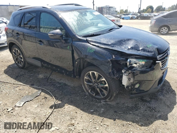 2016 Mazda CX-5 Grand Touring with VIN JM3KE2DY9G0777073, listed as a Copart auction lot 54200265 with 110,121 mi miles and Salvage Title. Bid and sale history available at carsss.com. Image 4.
