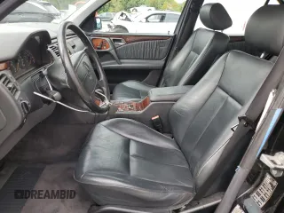 1999 Mercedes-Benz E-Class with VIN WDBJF65H4XA883351, listed as a Copart auction lot 73682964 with 156,446 mi miles and Salvage Title. Bid and sale history available at carsss.com. Image 7.