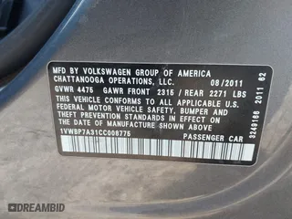 2012 Volkswagen Passat SE with VIN 1VWBP7A31CC008775, listed as a IAAI auction lot 41353437 with 118,815 mi miles. Bid and sale history available at carsss.com. Image 9.