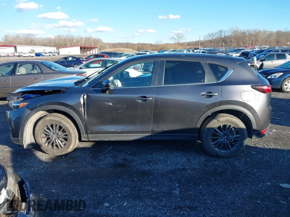 2021 Mazda CX-5 Touring with VIN JM3KFBCM8M1370640, listed as a IAAI auction lot 41207736 with 57,570 mi miles. Bid and sale history available at carsss.com. Image 15.