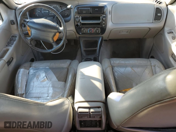 1997 Ford Explorer XL with VIN 1FMDU34E2VZC03015, listed as a Copart auction lot 80654764 with 295,587 mi miles and Salvage title. Bid and sale history available at DreamBid. Image 8.