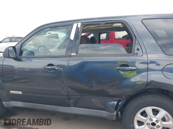 2008 Mazda Tribute ES with VIN 4F2CZ06188KM01024, listed as a IAAI auction lot 41890148 with 122,367 mi miles. Bid and sale history available at carsss.com. Image 14.