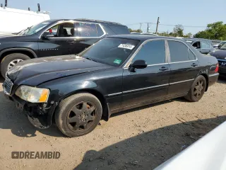 2002 Acura RL with VIN JH4KA96512C013028, listed as a Copart auction lot 71436914 with 142,527 mi miles and Salvage Title. Bid and sale history available at carsss.com. Image 1.