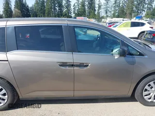 2013 Honda Odyssey LX z VIN 5FNRL5H29DB055166, wystawiony jako IAAI lot #41965037 z przebiegiem 122 470 mil mil oraz . Historia ofert i sprzedaży dostępna na DreamBid. Obrazek 13.