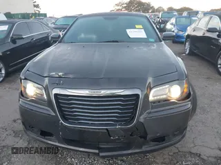 2014 Chrysler 300 S with VIN 2C3CCABG2EH352220, listed as a IAAI auction lot 41796284 with 127,070 mi miles and . Bid and sale history available at DreamBid. Image 6.