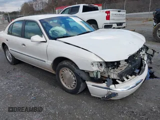 1998 Lincoln Continental with VIN 1LNFM97VXWY619313, listed as a IAAI auction lot 41477852 with 158,973 mi miles. Bid and sale history available at carsss.com. Image 1.