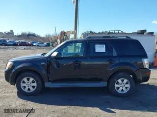 2009 Mercury Mariner with VIN 4M2CU91G99KJ12339, listed as a IAAI auction lot 41760508 with 176,421 mi miles. Bid and sale history available at carsss.com. Image 14.