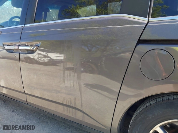 2011 Honda Odyssey EX-L with VIN 5FNRL5H60BB072101, listed as a IAAI auction lot 42002097 with 243,607 mi miles. Bid and sale history available at carsss.com. Image 21.