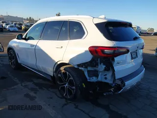 2021 BMW X5 sDrive40i with VIN 5UXCR4C03M9G59554, listed as a IAAI auction lot 41358056 with 47,577 mi miles. Bid and sale history available at carsss.com. Image 3.