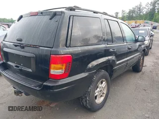 2000 Jeep Grand Cherokee Laredo with VIN 1J4G258S0YC182928, listed as a IAAI auction lot 42113376 with 259,882 mi miles and . Bid and sale history available at DreamBid. Image 4.