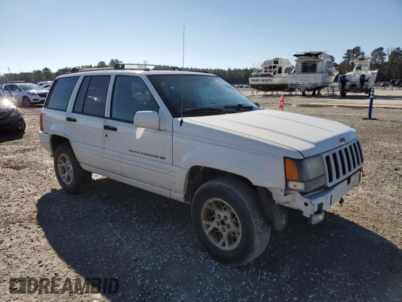 1998 Jeep Grand Cherokee Limited with VIN 1J4GZ78Y0WC307578, listed as a Copart auction lot 45272765 with 328,264 mi miles and Salvage title. Bid and sale history available at DreamBid. Image 4.