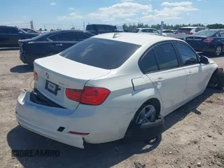 2014 BMW 3 Series 320i with VIN WBA3B1C51EK131063, listed as a IAAI auction lot 42043086 with 92,306 mi miles. Bid and sale history available at carsss.com. Image 4.