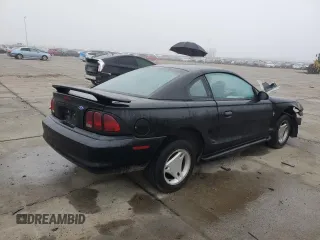 1997 Ford Mustang with VIN 1FALP4049VF136060, listed as a Copart auction lot 85389824 with 0 mi miles and Salvage Title. Bid and sale history available at carsss.com. Image 3.