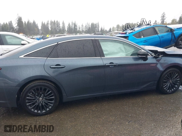 2021 Toyota Avalon Hybrid XSE z VIN 4T1EA1AB9MU007905, wystawiony jako IAAI lot #40501204 z przebiegiem 86 869 mil mil oraz . Historia ofert i sprzedaży dostępna na DreamBid. Obrazek 13.