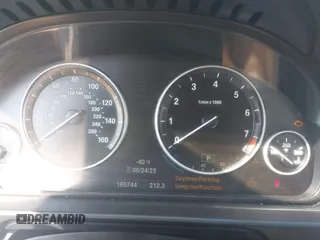 2015 BMW 5 Series 528i with VIN WBA5A5C52FD518794, listed as a IAAI auction lot 42571091 with 165,744 mi miles and . Bid and sale history available at DreamBid. Image 7.