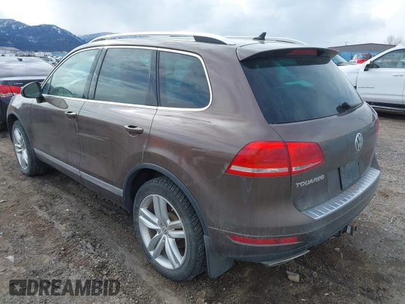 2013 Volkswagen Touareg Lux with VIN WVGEF9BP1DD012851, listed as a IAAI auction lot 41732391 with 123,283 mi miles and . Bid and sale history available at DreamBid. Image 3.