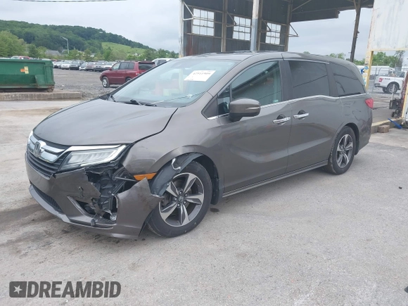 2018 Honda Odyssey Touring with VIN 5FNRL6H89JB057148, listed as a IAAI auction lot 42511909 with 166,438 mi miles and . Bid and sale history available at DreamBid. Image 2.