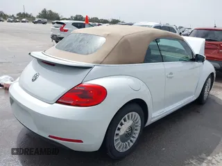 2015 Volkswagen Beetle 1.8T w/Tech with VIN 3VW517AT4FM812294, listed as a IAAI auction lot 41753967 with 59,857 mi miles and . Bid and sale history available at DreamBid. Image 4.