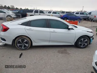 2020 Honda Civic LX with VIN 19XFC2F62LE021811, listed as a IAAI auction lot 41591466 with 75,797 mi miles and . Bid and sale history available at DreamBid. Image 14.