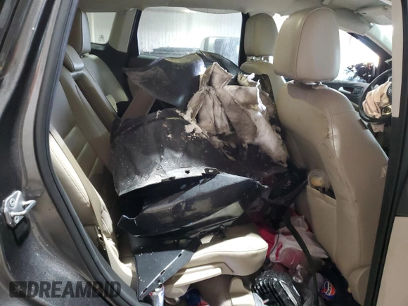 2015 Ford Escape Titanium with VIN 1FMCU9J93FUC86300, listed as a Copart auction lot 60852895 with 156,296 mi miles and Salvage title. Bid and sale history available at DreamBid. Image 11.