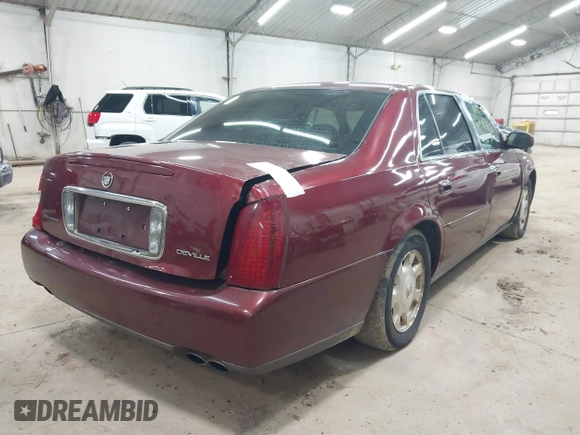 2002 Cadillac DeVille with VIN 1G6KD54Y12U214732, listed as a IAAI auction lot 42018412 with 139,474 mi miles. Bid and sale history available at carsss.com. Image 4.