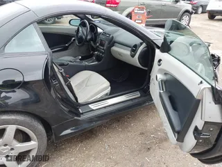 2006 Mercedes-Benz SLK-Class 3.5L with VIN WDBWK56FX6F084328, listed as a IAAI auction lot 41570145 with 104,929 mi miles. Bid and sale history available at carsss.com. Image 5.