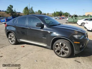 2014 BMW X6 50i with VIN 5UXFG8C54EL593085, listed as a Copart auction lot 75775084 with 0 mi miles and Salvage Title. Bid and sale history available at carsss.com. Image 4.
