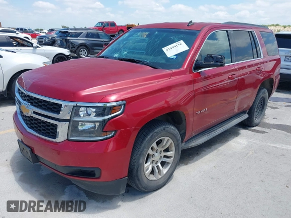 2015 Chevrolet Tahoe LS with VIN 1GNSCAEC4FR121571, listed as a IAAI auction lot 42499156 with 131,284 mi miles and . Bid and sale history available at DreamBid. Image 2.