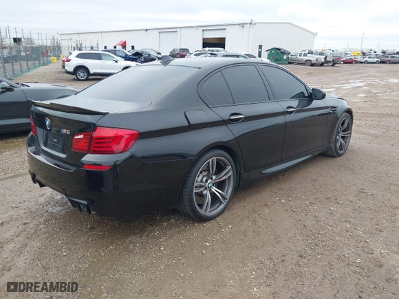 2013 BMW M5 with VIN WBSFV9C51DD095750, listed as a IAAI auction lot 40907304 with 93,014 mi miles. Bid and sale history available at carsss.com. Image 4.
