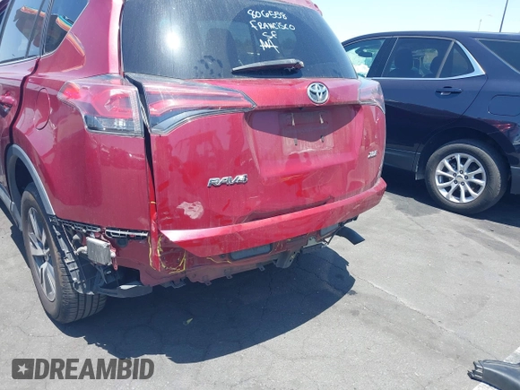 2018 Toyota RAV4 XLE with VIN 2T3WFREV4JW505053, listed as a IAAI auction lot 42552459 with 94,552 mi miles and . Bid and sale history available at DreamBid. Image 6.