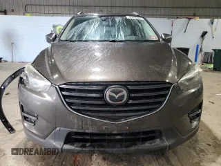 2016 Mazda CX-5 Grand Touring with VIN JM3KE4DY0G0765406, listed as a Copart auction lot 46499385 with 116,155 mi miles and Salvage Title. Bid and sale history available at carsss.com. Image 5.