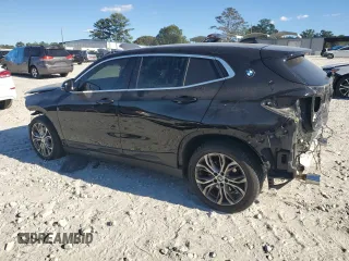 2021 BMW X2 sDrive28i with VIN WBXYH9C08M5S47984, listed as a Copart auction lot 74954164 with 70,829 mi miles and Salvage Title. Bid and sale history available at carsss.com. Image 2.