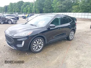 2021 Ford Escape Titanium Hybrid z VIN 1FMCU0DZ0MUA16798, wystawiony jako IAAI lot #42502086 z przebiegiem 107 250 mil mil oraz . Historia ofert i sprzedaży dostępna na DreamBid. Obrazek 2.