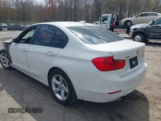 2015 BMW 3 Series 328i xDrive with VIN WBA3B5C51FF960765, listed as a IAAI auction lot 42074658 with 106,598 mi miles and . Bid and sale history available at DreamBid. Image 3.