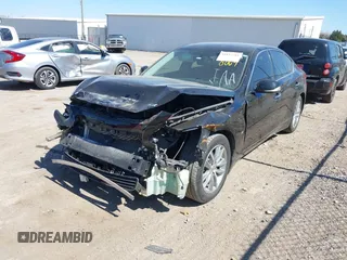 2015 Infiniti Q50 Premium with VIN JN1BV7AP9FM348009, listed as a IAAI auction lot 41852281 with 124,118 mi miles. Bid and sale history available at carsss.com. Image 18.