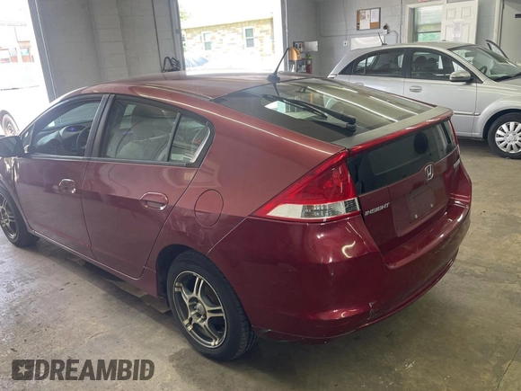 2010 Honda Insight LX with VIN JHMZE2H59AS032860, listed as a Copart auction lot 60861945 with 253,444 mi miles and Clean title. Bid and sale history available at DreamBid. Image 3.