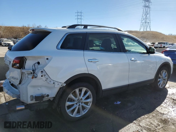 2015 Mazda CX-9 Grand Touring с VIN JM3TB2DA1F0462203, выставлен на аукционе Copart как лот 37073714 с пробегом 101 293 миль миль и Списание • Salvage title. История ставок и продаж доступна на DreamBid. Изображение 3.