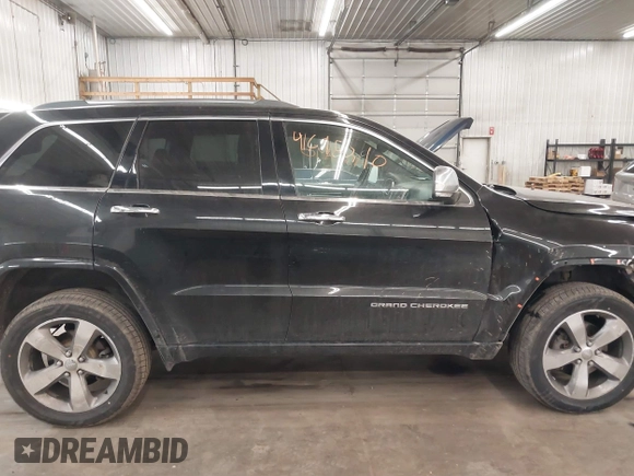 2014 Jeep Grand Cherokee Overland with VIN 1C4RJFCG8EC177899, listed as a IAAI auction lot 41695290 with 200,867 mi miles and . Bid and sale history available at DreamBid. Image 14.