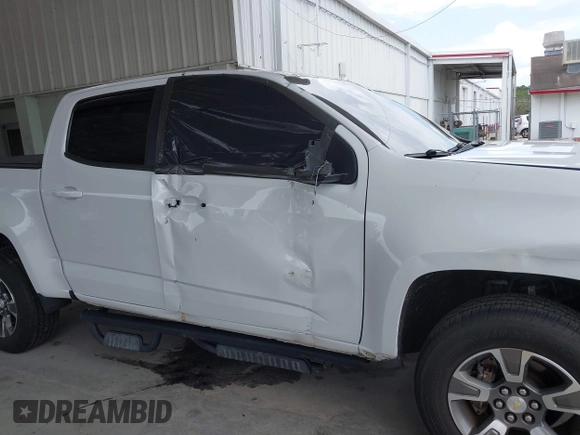 2020 Chevrolet Colorado 2WD Z71 with VIN 1GCGSDEN2L1159458, listed as a IAAI auction lot 42412924 with 90,011 mi miles and . Bid and sale history available at DreamBid. Image 6.