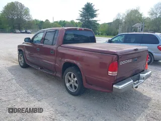 2001 Dodge Dakota Sport with VIN 1B7HL2AN91S278613, listed as a IAAI auction lot 42047239 with 178,321 mi miles and . Bid and sale history available at carsss.com. Image 3.